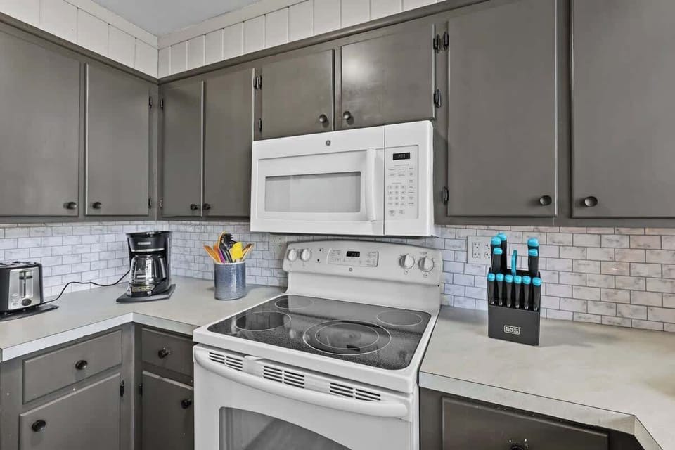 Entertainment Hub: The fully equipped kitchen seamlessly opens onto the inviting living room, creating the perfect atmosphere for countless memorable evenings.