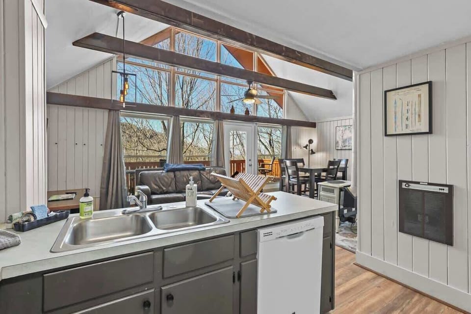 Seamless Connection: Experience the flow of home life as the fully equipped kitchen effortlessly opens onto the charming living room, setting the stage for evenings filled with warmth and laughter.