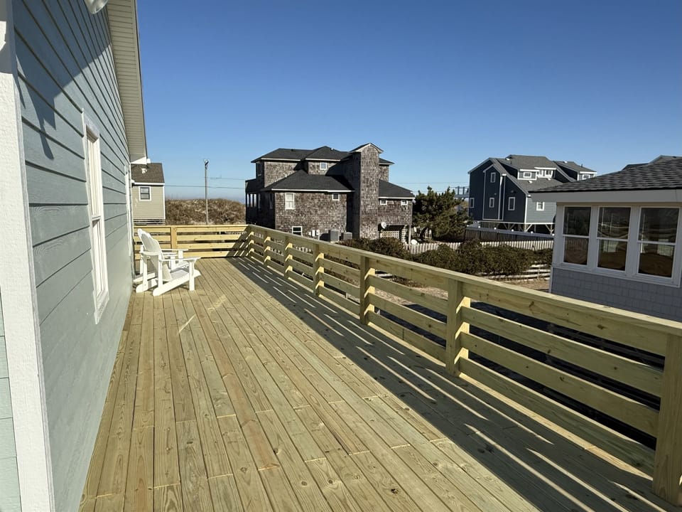 New deck with safety gates at the top of both sets of stairs so your dogs or kids stay safe. 