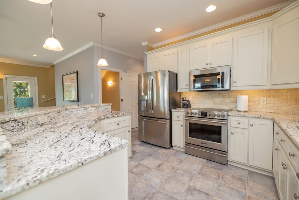 Main level. Electric stovetop, oven, dishwasher, refrigerator and microwave.