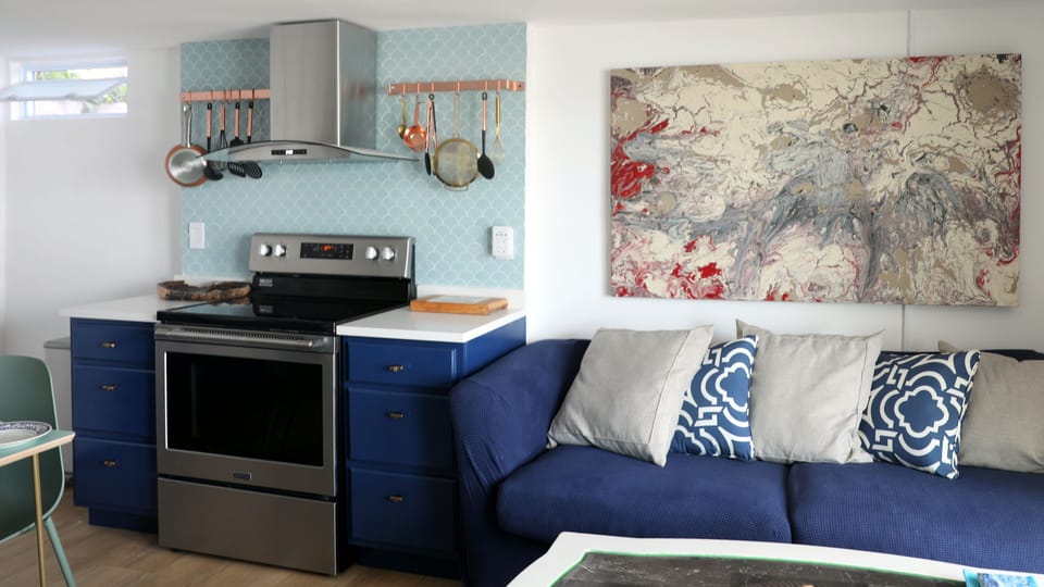 Kitchen area has a dining room area as well as a lounge area for relaxing.