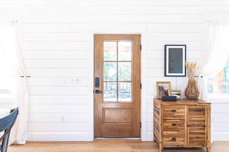 The front door is the gateway to your Needle + Pine experience, an elevated yet authentic Broken Bow vacation.