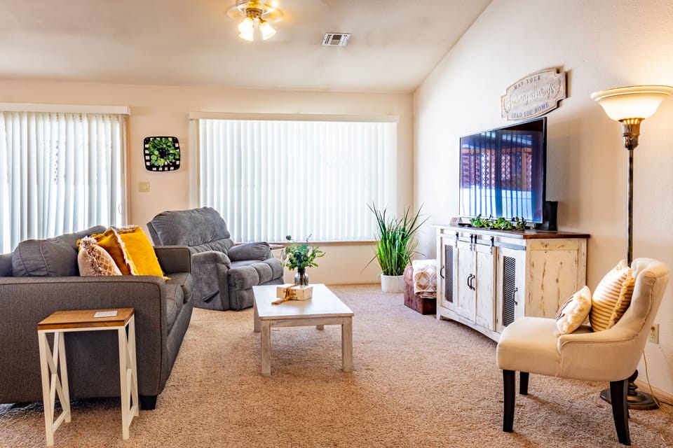 Large living room with space for the whole family to relax and enjoy a movie.