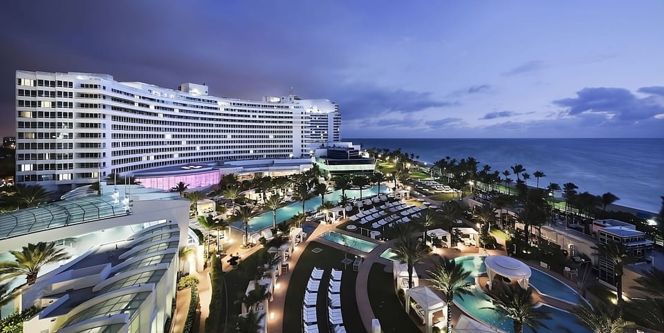 Soak up the glamorous evening glow across the oceanfront resort.