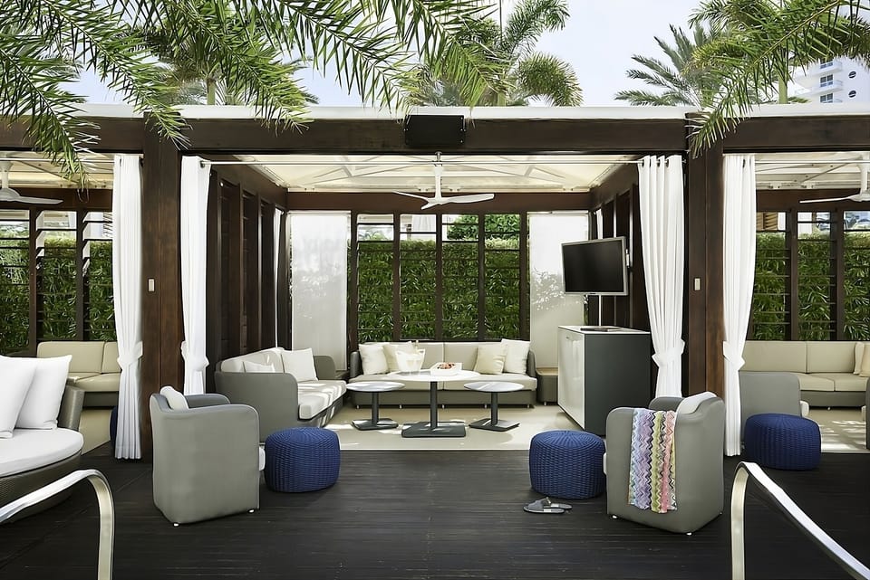 Lounge in a shaded cabana with breezy, resort comfort.