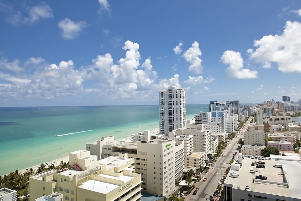 Admire the iconic coastline from above under blue skies.