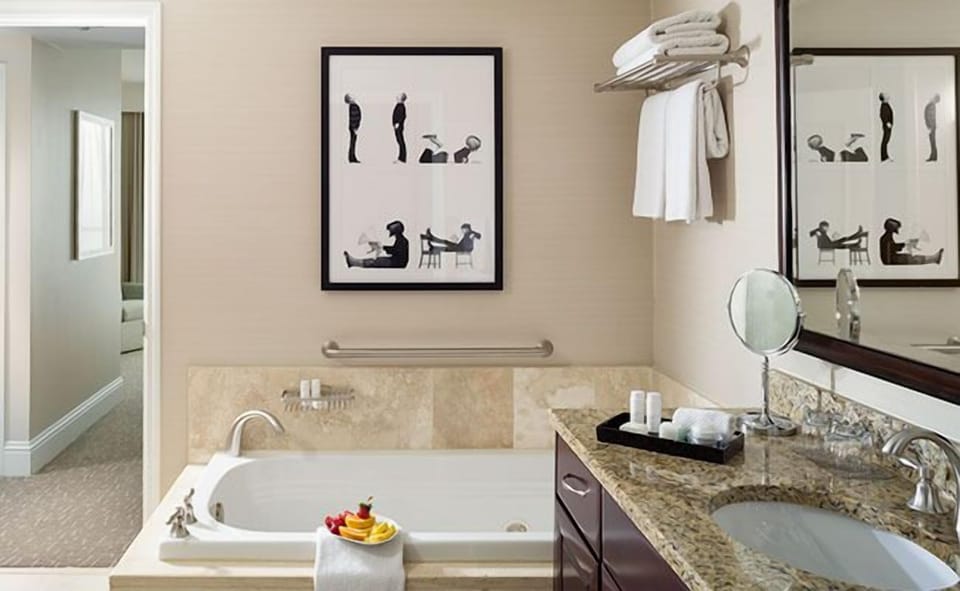 Soak in a deep tub and refresh at granite vanity.