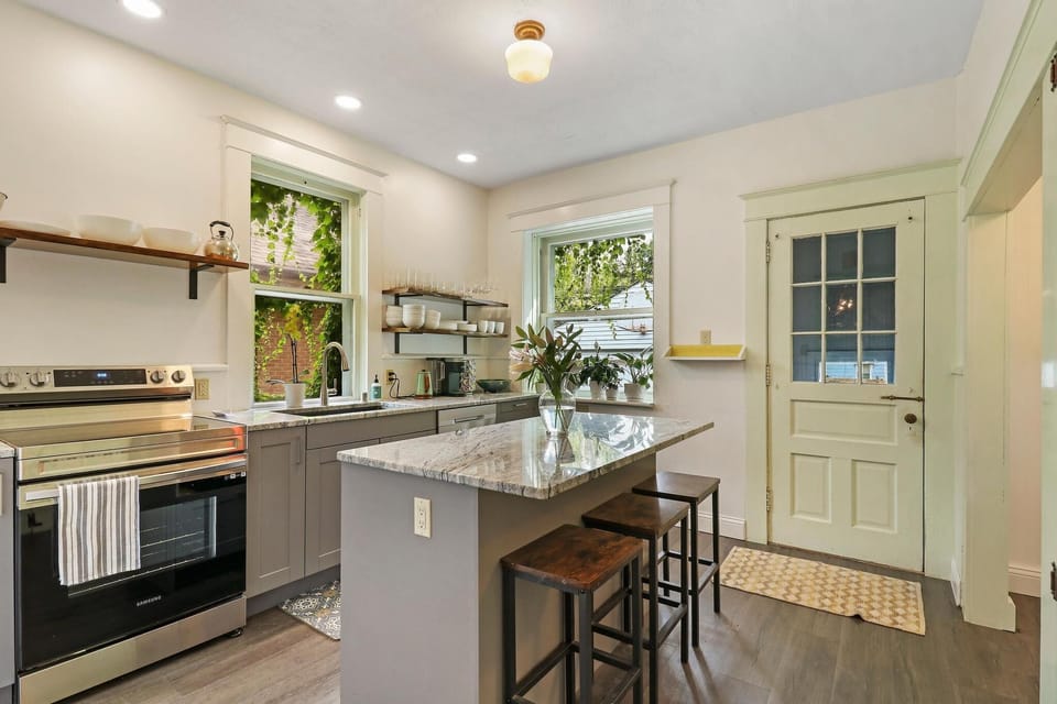 modern kitchen with kuerig coffee maker and tea pot