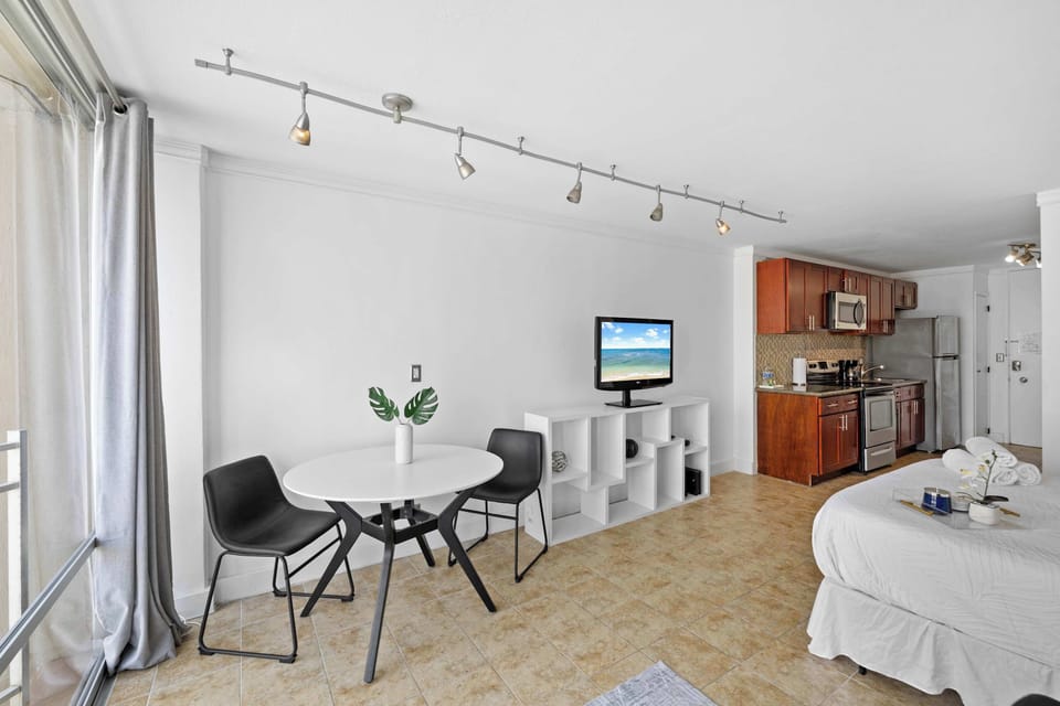 Open-concept living room and kitchen, perfect for enjoying meals or relaxing on the sofa while taking in the cozy atmosphere.