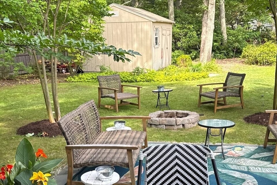 Backyard, firepit, and storage barn