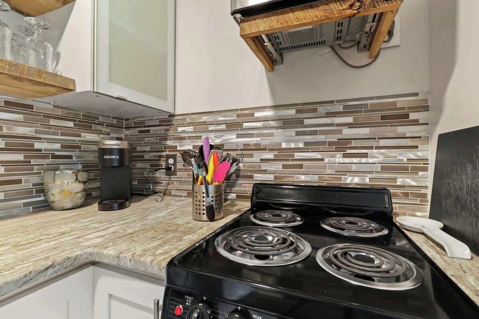 Embrace simplicity in this cozy kitchenette—where functionality meets charm for a delightful culinary journey.