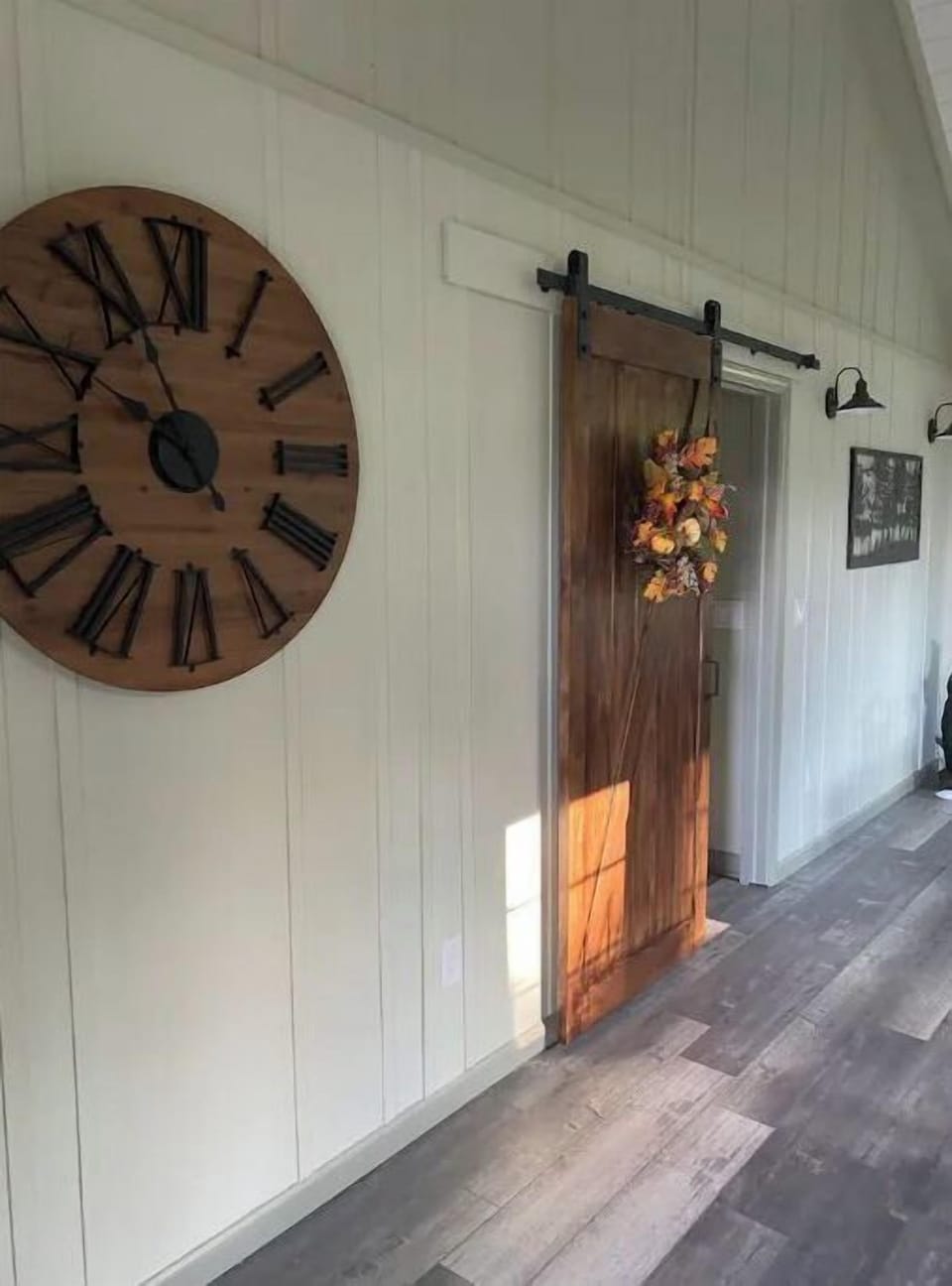 Barn door entrance into Master bedroom located on the main floor