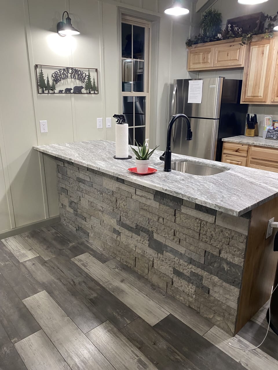 Kitchen area with bar area and seating for four (4 bar stools are not pictured)
