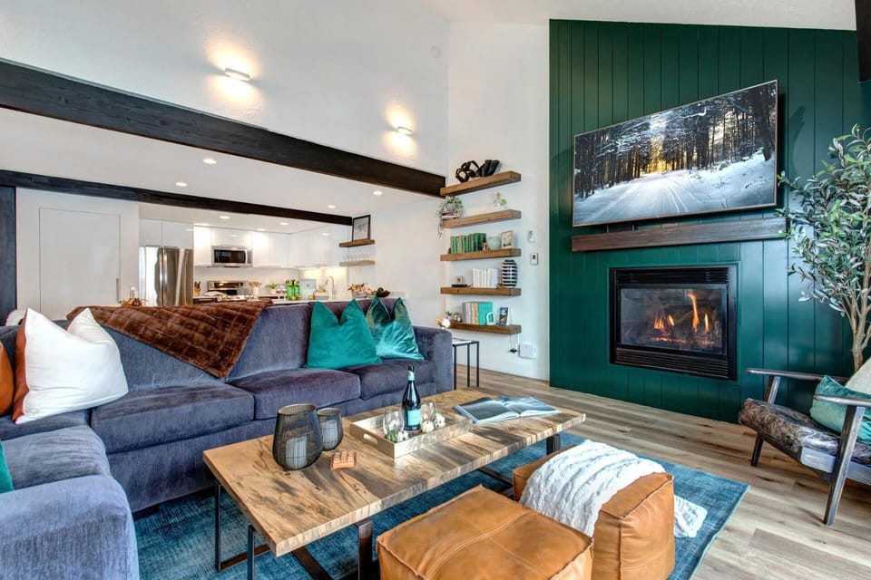 Cozy mountain retreat with fireplace, plush seating, and modern elegance.