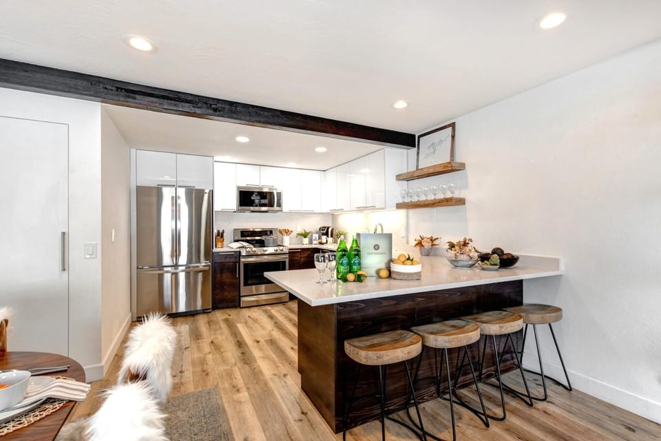 Modern rustic kitchen with wood accents and cozy lighting.