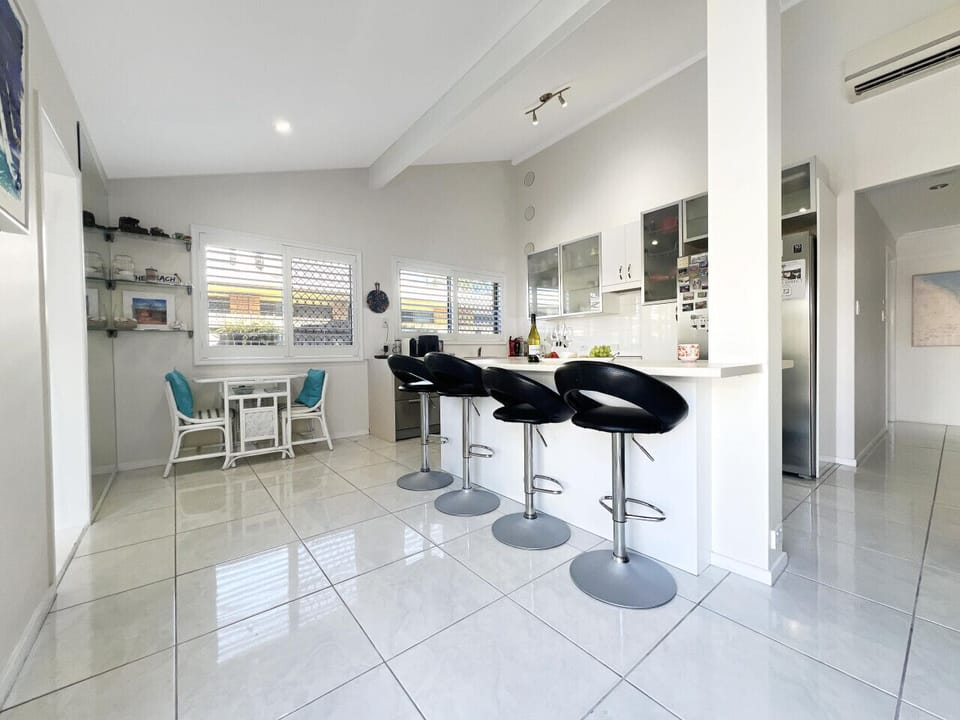 The open plan kitchen/dining living space is a great place to chat with your fellow holiday makers while sharing a wine and preparing a meal.