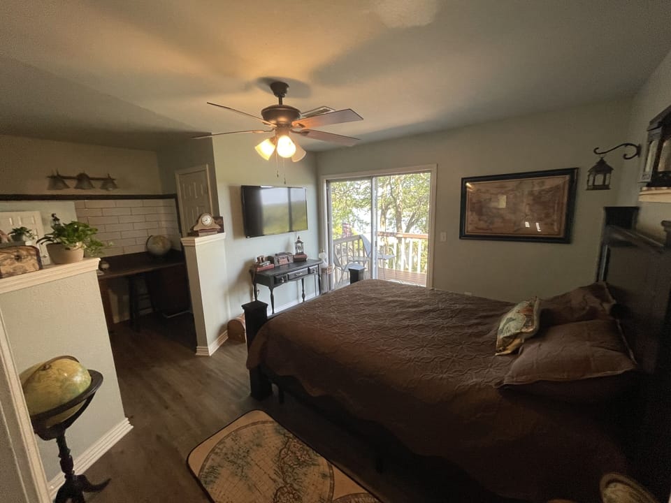 Upstairs - master bedroom with sliding glass doors to balcony