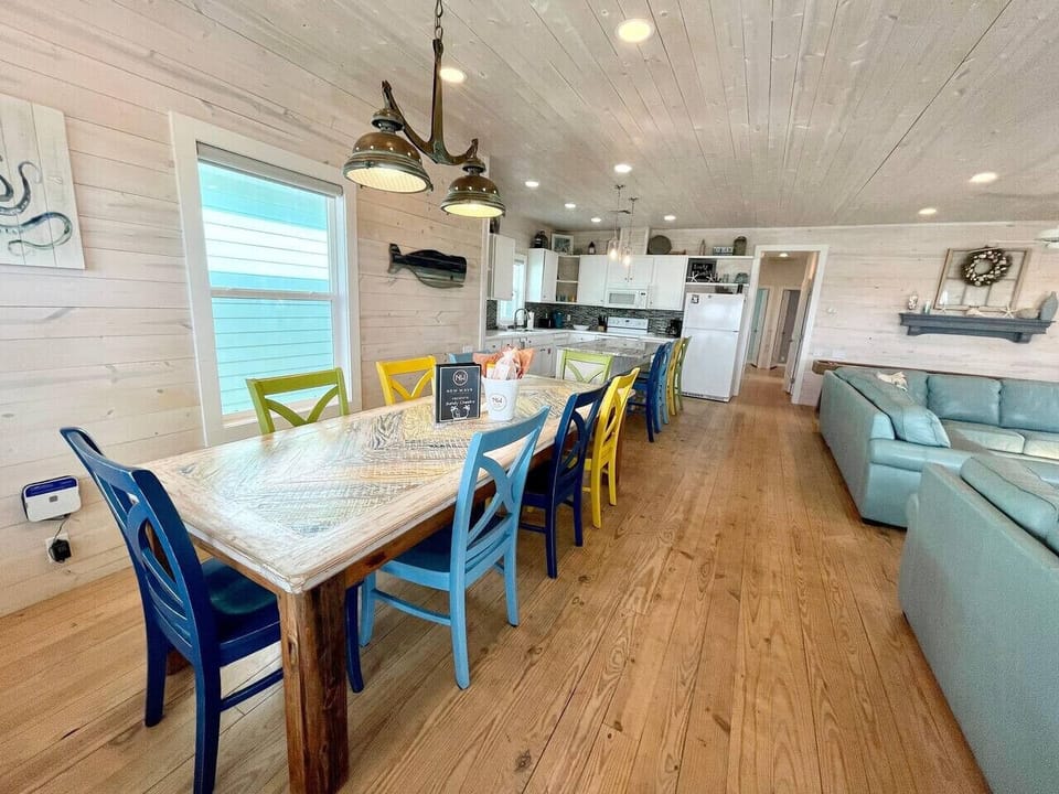 Spacious beach-style dining space with ocean tones