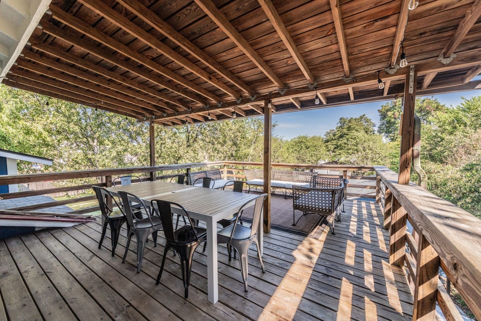Large private back deck-partially covered over dining table area; lounge couches