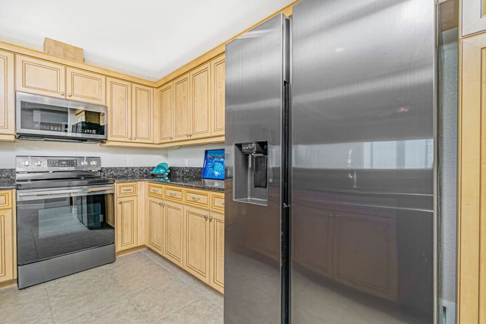 Kitchen Appliances Include Fridge with Ice Maker and Water. Microwave and Stove with Oven