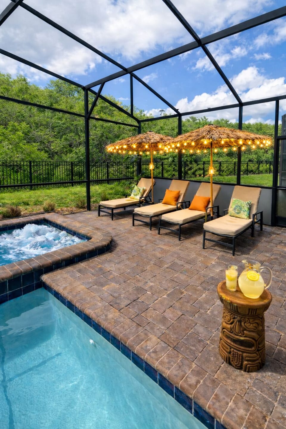 Unwind poolside in your private screened retreat, featuring a bubbling spa, cozy