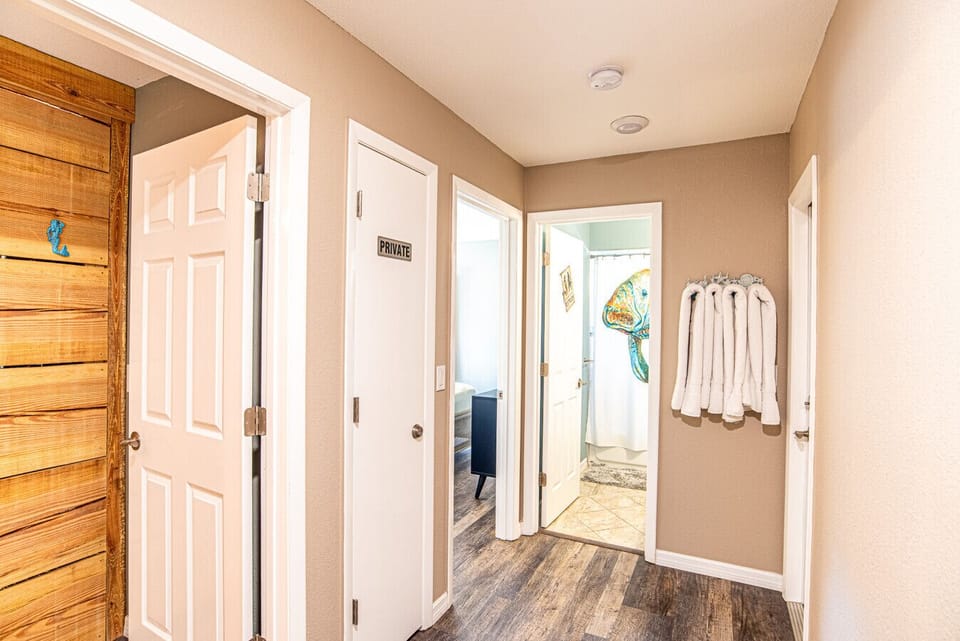 Hallway with other 2 bedrooms and the hall bathroom