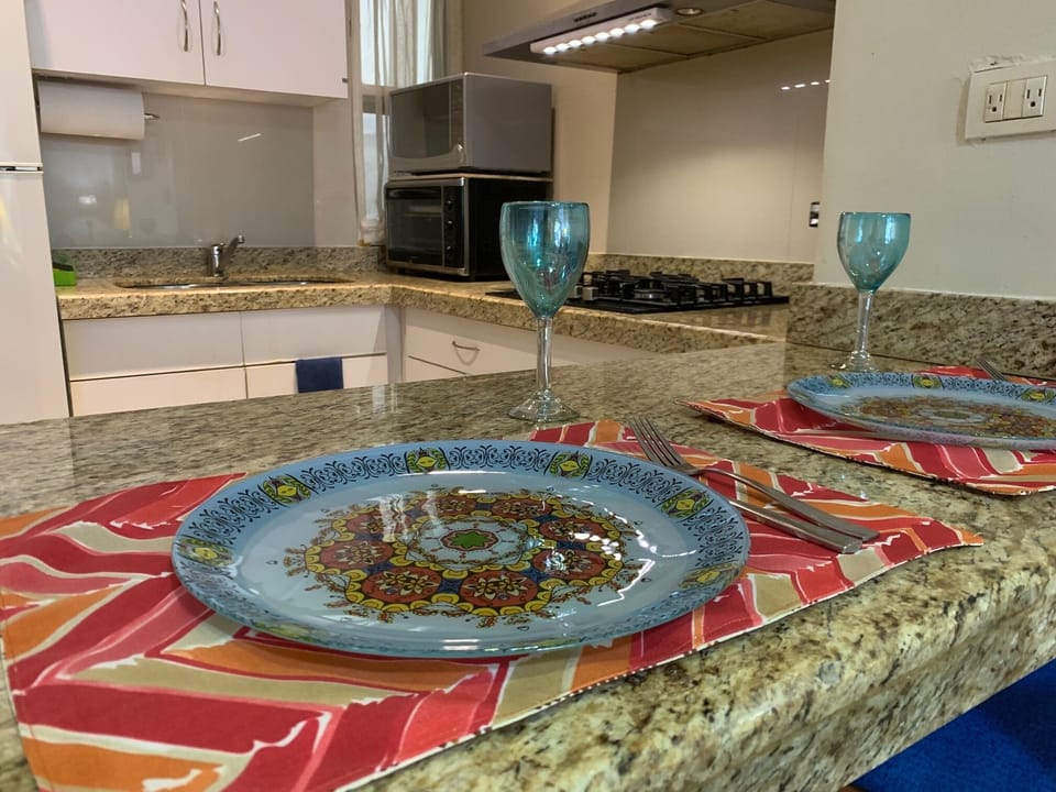 Two seat breakfast bar to enjoy quick meals. Plenty of dishes/glasses, utensils.