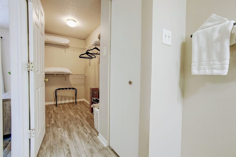 Walk in closet in master bedroom.