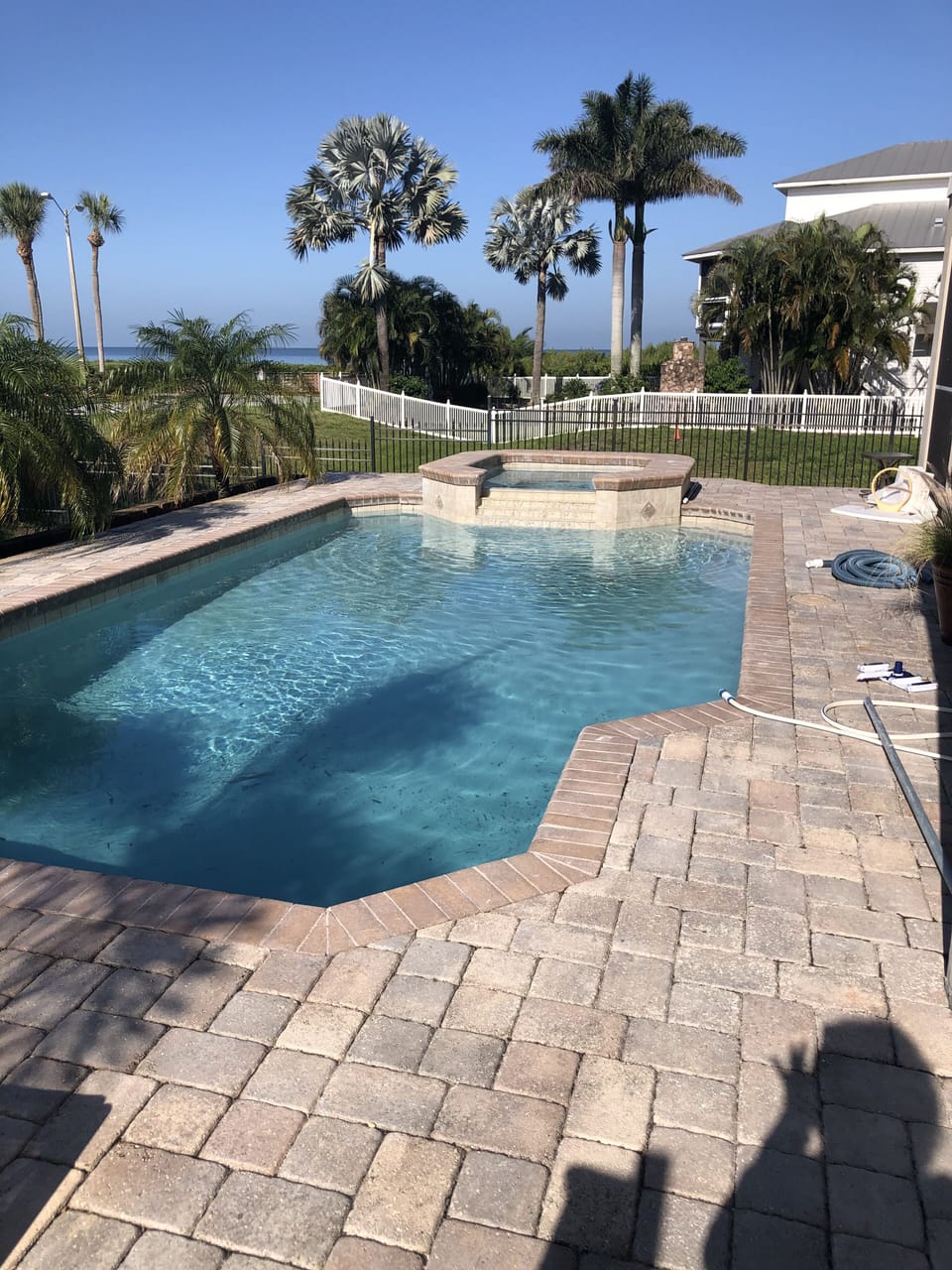  Salt water heated pool with spa, lounge chairs, adjacent to lanai w grill. 