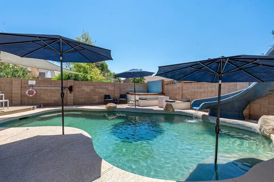 Wonderful pool with a slide!  Great for fun or basking in the sun.