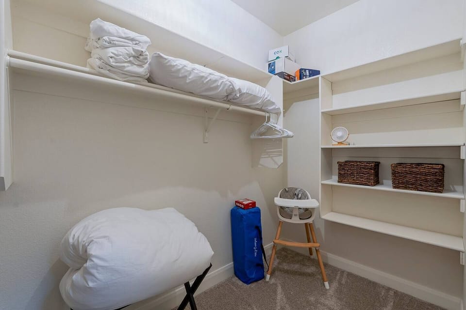 The primary closet has space for all your things including a few extras stored there.