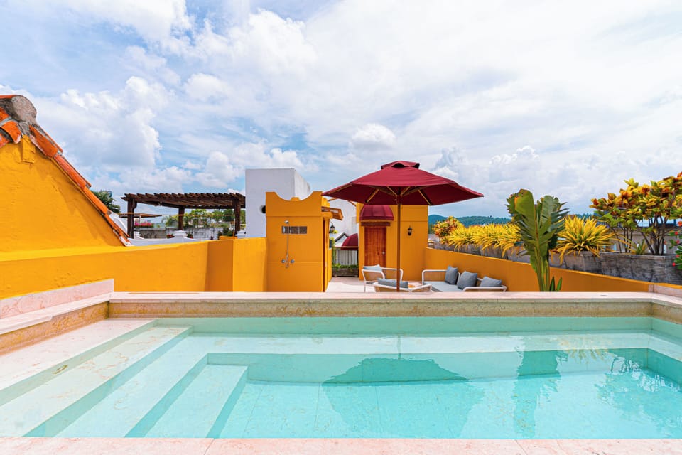 Rooftop pool · Blue sky · Panoramic Historic Center views · 24h