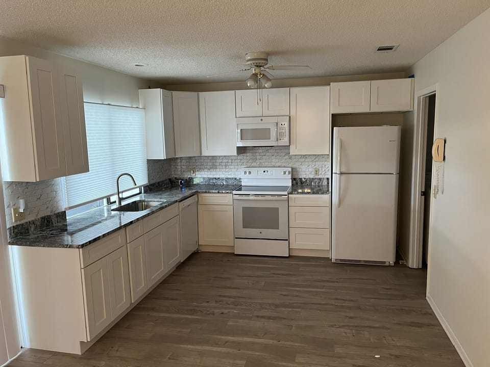 New Kitchen with new refrigerator, dishwasher, range, microwave and washer/dryer
