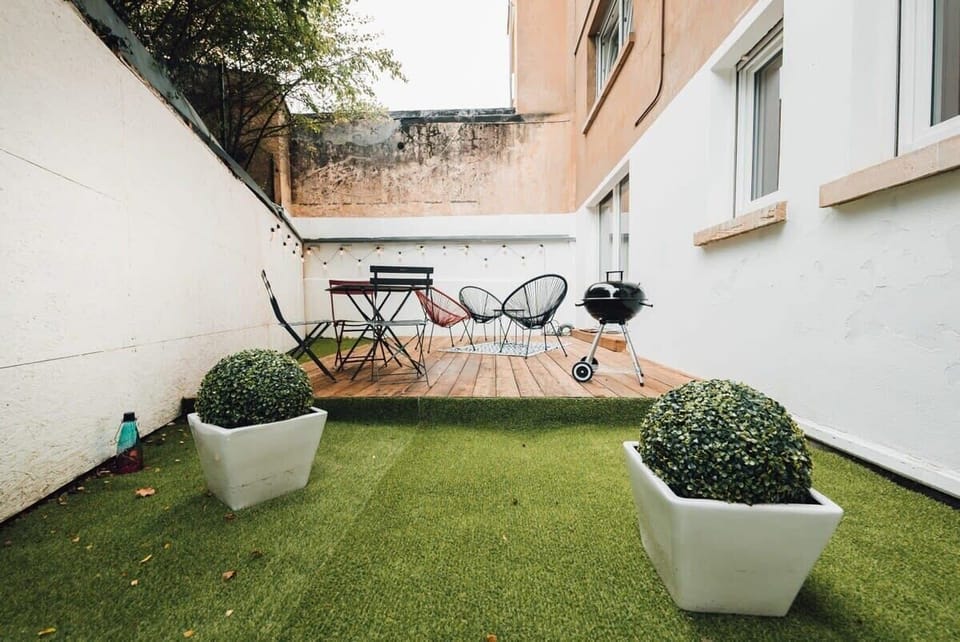 Private outdoor patio with seating area, ideal for enjoying morning coffee or evening drinks in a peaceful setting.