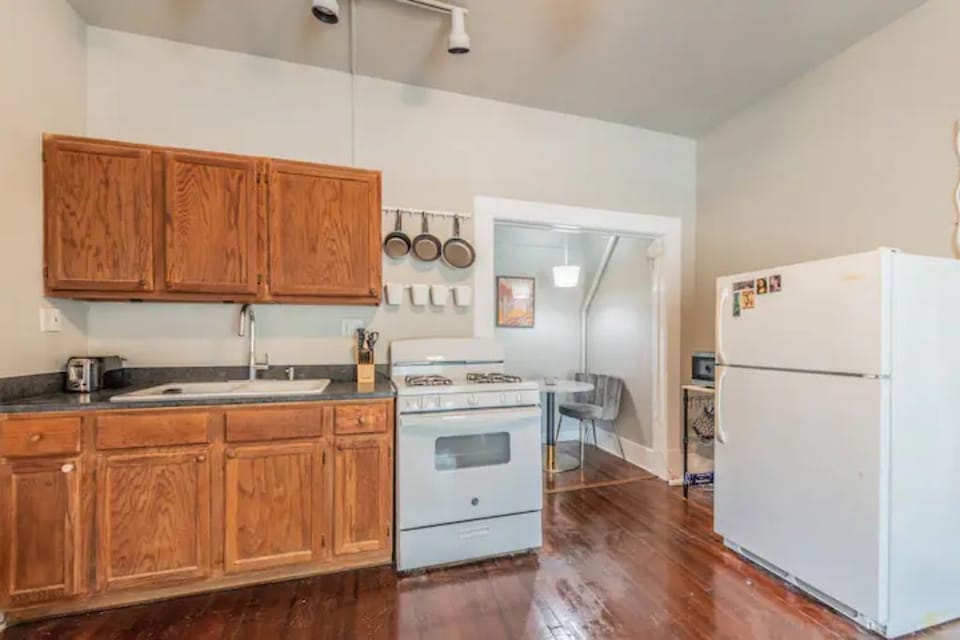 Kitchen w full sized refrigerator, stove, microwave, large coffee maker, kettle