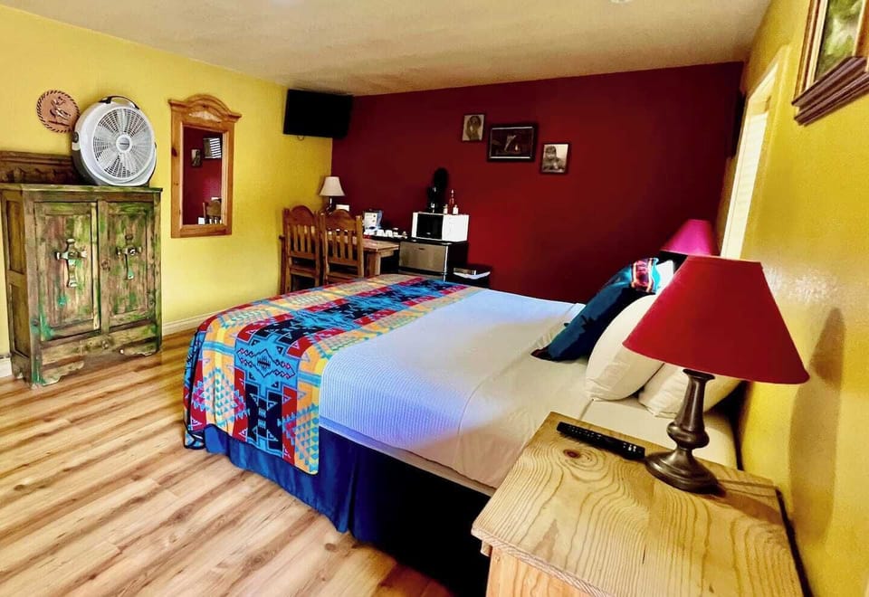 Comfortable King size bed. Dining table, mini-fridge, microwave, and coffee maker.