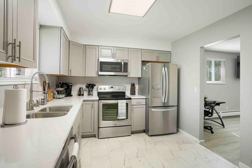 Kitchen is brand new and has quartz countertops, and plenty of cooking space. Coffee station is fully stocked and ready!