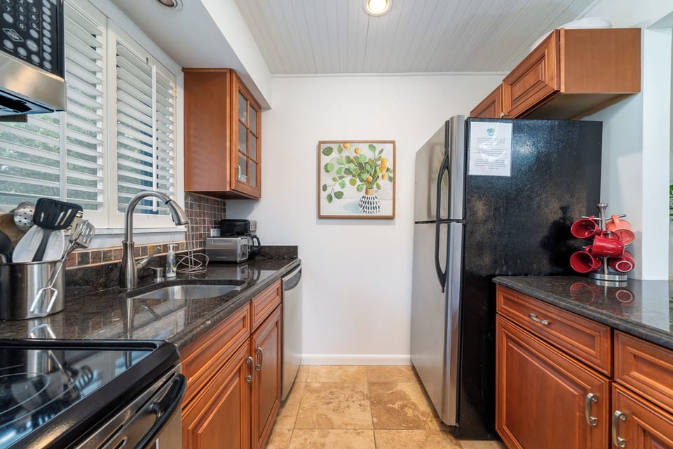 The kitchen has stainless steel appliances