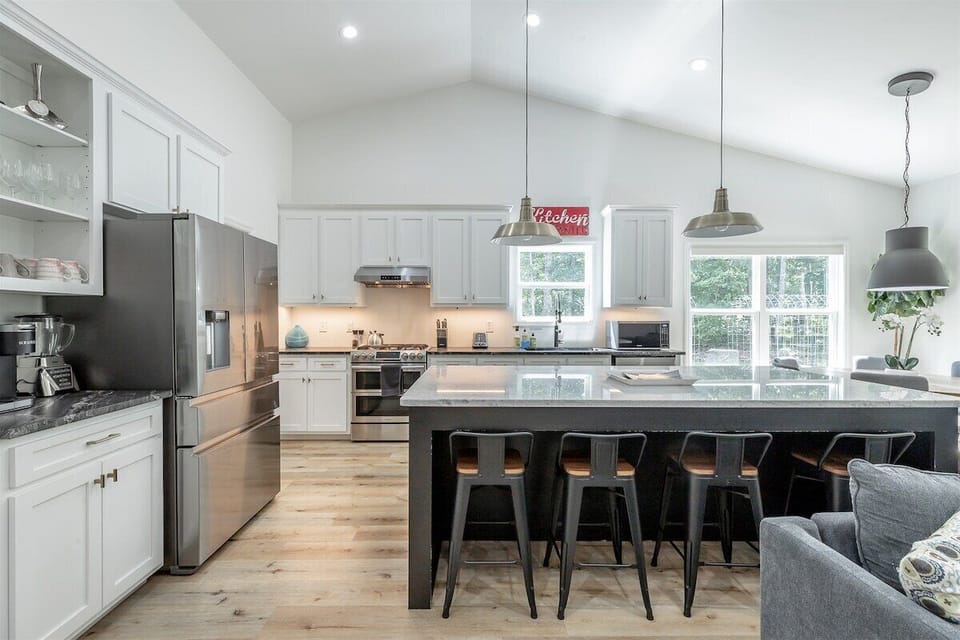 open concept kitchen, living room, and dining