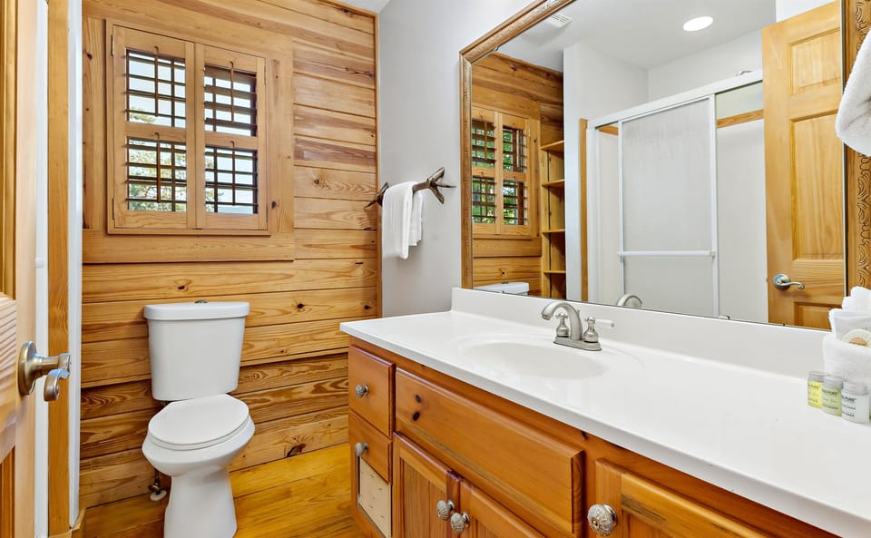 Upstairs bathroom with combination shower/bathtub