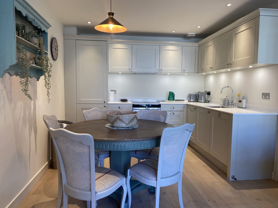 Modern kitchen with dining table
