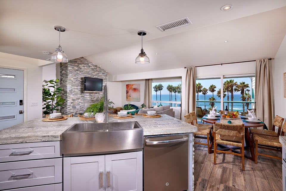 open concept island counter, living/dining area with ocea views