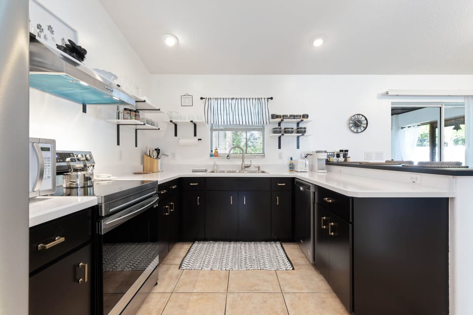 View into the updated kitchen with open shelving