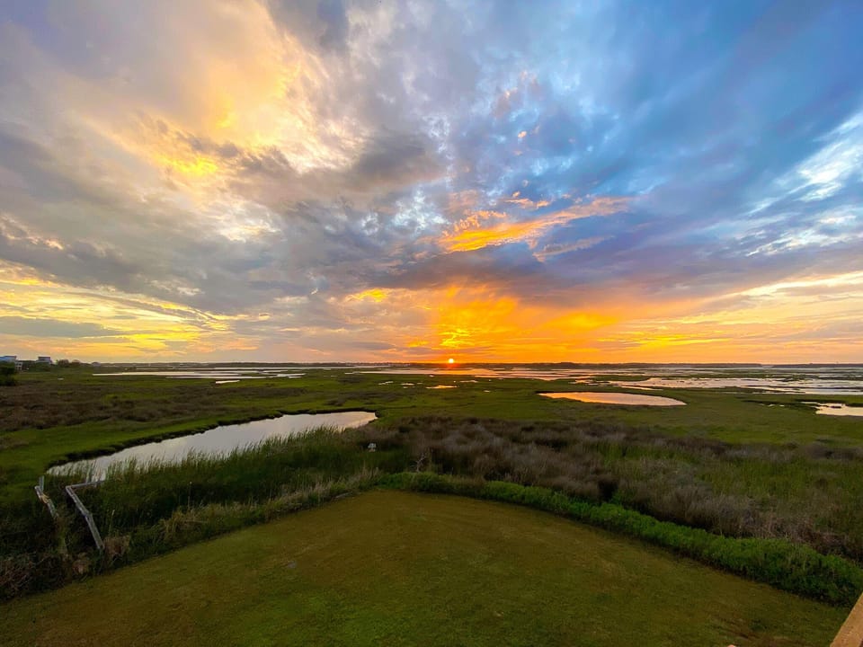 The back decks have some of the best views to watch the sunset over the marsh.