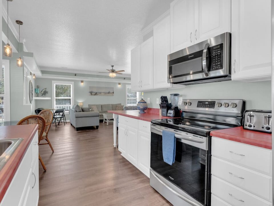 Updated kitchen with stainless steel appliances.
