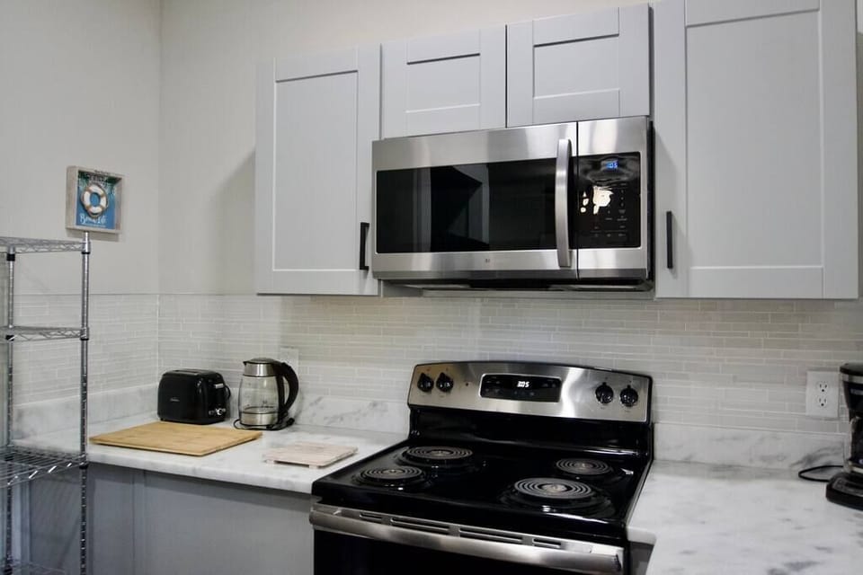 Full kitchen with brand new appliances and beautiful counter tops