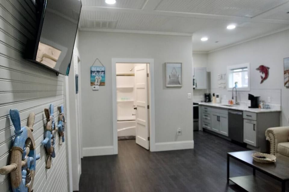 View of front of house including living room, full kitchen and storage space
