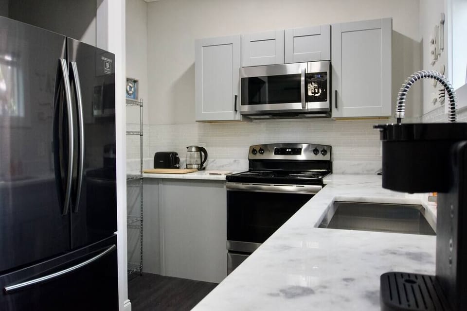 Full kitchen with brand new appliances and beautiful counter tops