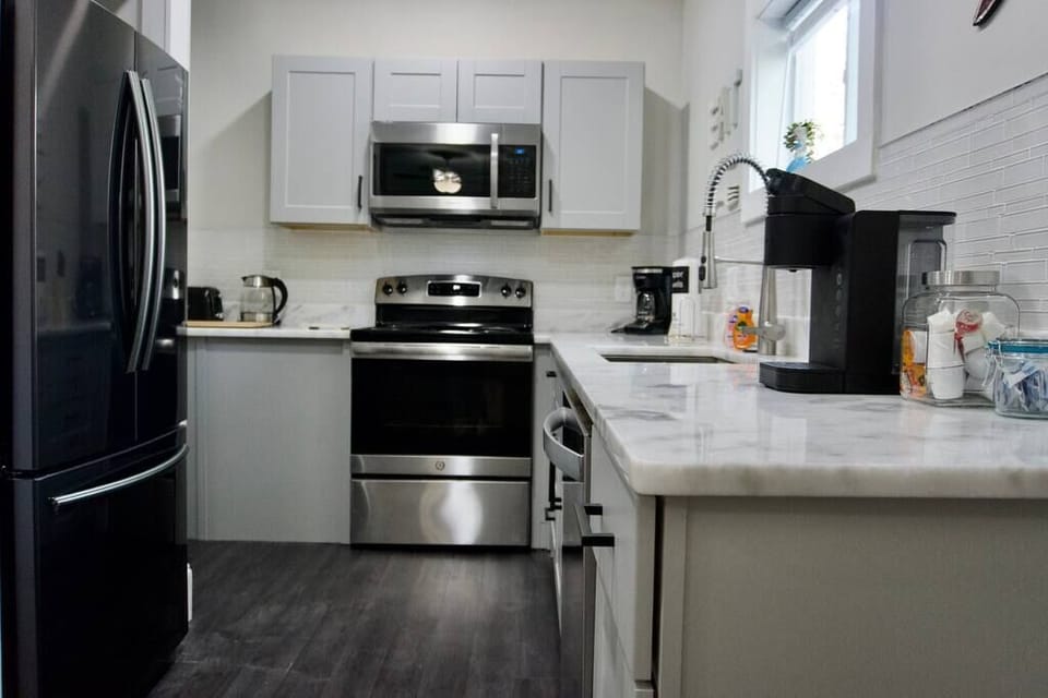 Full kitchen with brand new appliances and beautiful counter tops