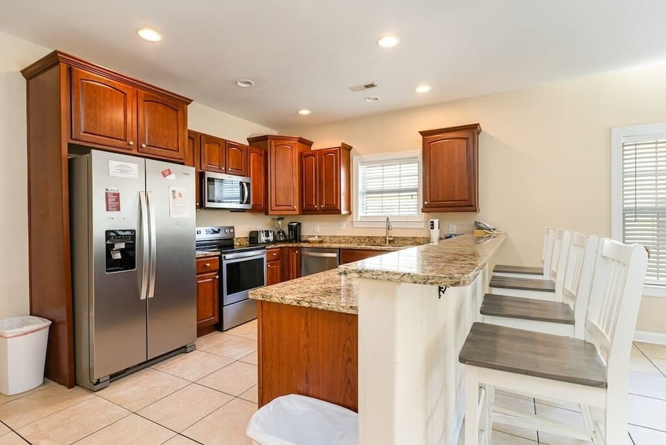 Spacious full kitchen with countertop bar seating